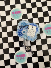 Load image into Gallery viewer, Blue Floral Eye Chart Optometry Retractable Badge Reel
