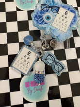 Load image into Gallery viewer, Blue Floral Eye Chart Optometry Retractable Badge Reel
