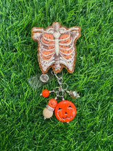 Load image into Gallery viewer, Pumpkin Ribcage Retractable Badge Reel

