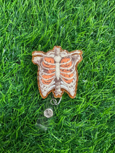 Load image into Gallery viewer, Pumpkin Ribcage Retractable Badge Reel

